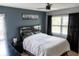 Comfortable bedroom with a ceiling fan, black out curtains and a neutral color scheme at 3154 Stonecastle Rd, Orlando, FL 32822
