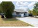 Single story home with a small, fenced front yard and a simple landscaping at 3154 Stonecastle Rd, Orlando, FL 32822