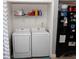 Laundry area features a modern washing machine and dryer in a closet at 3154 Stonecastle Rd, Orlando, FL 32822