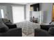 Cozy living room with gray sofas, large rug, TV, and sliding doors to the outside at 3154 Stonecastle Rd, Orlando, FL 32822