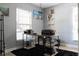 Bright office space featuring a large window, light grey walls, and a work desk on a black rug at 3154 Stonecastle Rd, Orlando, FL 32822
