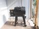 Pellet grill on covered patio with access to the backyard at 3154 Stonecastle Rd, Orlando, FL 32822