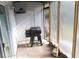 Covered patio featuring a pellet grill and access to the fenced in backyard at 3154 Stonecastle Rd, Orlando, FL 32822