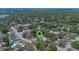 An aerial view of a home surrounded by mature trees and neighborhood streets at 3199 Tobago Ct, Apopka, FL 32703