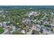 An aerial view of a home surrounded by mature trees and neighborhood streets at 3199 Tobago Ct, Apopka, FL 32703