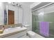 Bathroom featuring a shower with glass doors and a towel rack, a vanity, and toilet at 3199 Tobago Ct, Apopka, FL 32703
