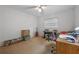 Bedroom features neutral carpet, a ceiling fan, and a window with blinds at 3199 Tobago Ct, Apopka, FL 32703