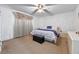 Bedroom featuring neutral carpet, a bed with white and blue bedding, and a ceiling fan at 3199 Tobago Ct, Apopka, FL 32703