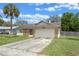 Inviting single-story home featuring a one-car garage and a well-maintained front lawn with driveway at 3199 Tobago Ct, Apopka, FL 32703