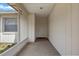 Covered front porch with door providing a sheltered entrance to the home at 3199 Tobago Ct, Apopka, FL 32703