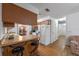 This kitchen has a breakfast bar, tile floors and a view to the dining room at 3199 Tobago Ct, Apopka, FL 32703