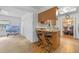 Eat-in kitchen features a breakfast bar with seating and an open view to the dining area at 3199 Tobago Ct, Apopka, FL 32703