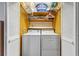 Laundry room features a washer and dryer with overhead shelving at 3199 Tobago Ct, Apopka, FL 32703