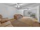 Spacious living room with carpet flooring, ceiling fans, and comfortable seating at 3199 Tobago Ct, Apopka, FL 32703