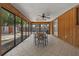 The sunroom overlooks the pool and backyard, perfect for relaxing or entertaining at 3199 Tobago Ct, Apopka, FL 32703