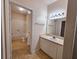 Bathroom featuring a vanity, a large mirror, and a bathtub at 3577 Conroy Rd # 331, Orlando, FL 32839