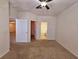 Bedroom with doorways to the bathroom and hallway and neutral carpet at 3577 Conroy Rd # 331, Orlando, FL 32839
