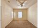 Spacious bedroom featuring a ceiling fan, neutral carpet and a window for ample light at 3577 Conroy Rd # 331, Orlando, FL 32839