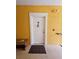 Condo entrance featuring a secure front door, welcome mat, and exterior lighting at 3577 Conroy Rd # 331, Orlando, FL 32839