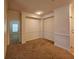 Comfortable living area featuring neutral walls, plush carpet, and white trim at 3577 Conroy Rd # 331, Orlando, FL 32839