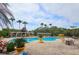 Relax by the community pool, featuring ample seating, umbrellas and meticulously maintained landscaping at 3577 Conroy Rd # 331, Orlando, FL 32839