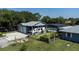 Aerial view of a home featuring RV parking, a garage, and lush landscaping at 4170 Packard Ave, St Cloud, FL 34772