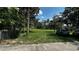 Expansive backyard featuring lush greenery and mature trees at 4170 Packard Ave, St Cloud, FL 34772