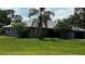 Charming single-story home featuring a well-manicured lawn and mature landscaping at 4170 Packard Ave, St Cloud, FL 34772