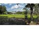 Exterior of home with a spacious lawn and detached garage at 4170 Packard Ave, St Cloud, FL 34772
