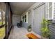 Covered front porch with rocking chairs and 'welcome' mat for a cozy entrance at 4170 Packard Ave, St Cloud, FL 34772
