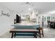 Open-concept kitchen with granite countertops, white cabinets, and a large island at 4170 Packard Ave, St Cloud, FL 34772