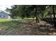 Image of a shady yard next to the house at 4170 Packard Ave, St Cloud, FL 34772