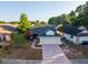 Aerial view of a charming single Gathering home with mature trees and landscaping at 4232 Sandhurst Dr, Orlando, FL 32817