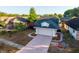 Aerial view of a well-maintained house with mature trees and a long driveway at 4232 Sandhurst Dr, Orlando, FL 32817