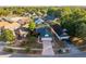 High angle view of a single Gathering home with well-manicured landscaping and mature trees at 4232 Sandhurst Dr, Orlando, FL 32817
