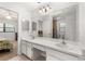 Bathroom featuring double sinks, a large mirror and views to the bedroom and shower at 4232 Sandhurst Dr, Orlando, FL 32817