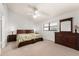 Bedroom with two beds, ceiling fan, a dresser and ensuite closets at 4232 Sandhurst Dr, Orlando, FL 32817