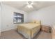Bright bedroom featuring a queen bed, carpeted floors and natural light at 4232 Sandhurst Dr, Orlando, FL 32817