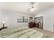 Bedroom with two beds, ceiling fan, a dresser and ensuite closets at 4232 Sandhurst Dr, Orlando, FL 32817