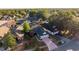 Charming single-Gathering home featuring a well-maintained front yard with mature trees and an inviting driveway at 4232 Sandhurst Dr, Orlando, FL 32817