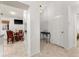 Hallway that offers a view into a breakfast nook, with a sleek console table and white walls at 4232 Sandhurst Dr, Orlando, FL 32817