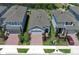 An aerial view showcases this single Gathering home with brick drive, manicured yard and a view of the water at 4548 Dulwik Pl, Sanford, FL 32771
