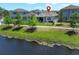 Aerial view of backyard with pond and surrounding homes, marked with a red pin at 4548 Dulwik Pl, Sanford, FL 32771