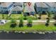 Aerial view of backyard with pond and surrounding homes, marked with a red pin at 4548 Dulwik Pl, Sanford, FL 32771