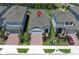 An aerial view showcases this single Gathering home with brick drive, manicured yard and a view of the water at 4548 Dulwik Pl, Sanford, FL 32771