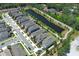 A neighborhood featuring well-maintained homes next to a tranquil pond at 4548 Dulwik Pl, Sanford, FL 32771