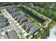 A neighborhood featuring well-maintained homes next to a tranquil pond at 4548 Dulwik Pl, Sanford, FL 32771