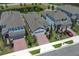 An aerial view showcases this single Gathering home with brick drive and manicured front yard at 4548 Dulwik Pl, Sanford, FL 32771