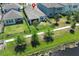 Aerial view showing a home with a black metal fenced yard that borders a pond at 4548 Dulwik Pl, Sanford, FL 32771