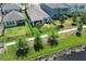Aerial view showing a home with a black metal fenced yard that borders a pond at 4548 Dulwik Pl, Sanford, FL 32771
